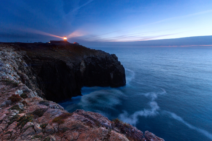 Portugal Sunset frames the lighthouse overlooking the Atlantic Ocean Cabo De Sao Vicente Sagres Algarve Portugal Europe Photo by Alfonso Della Corte