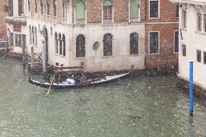 Veneto, Italy A traditional venetian gondola in Grand Canal during a snowfall, Venice, Veneto, Italy Photo by Diego Cuzzolin