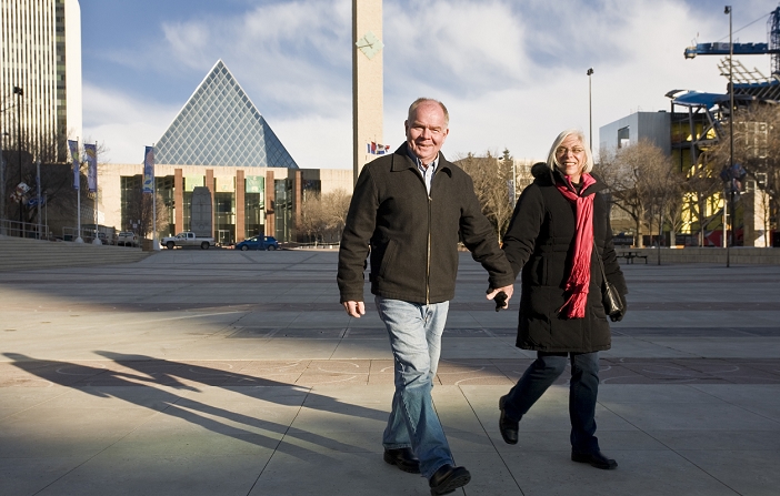 Senior couple holding hands and walking, Edmonton, Alberta, Canada