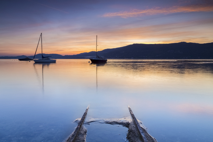 Lombardy, Italy Emerged boat rails at Sasso Moro dock during an autumnal sunset, Sasso Moro, Leggiuno, Lake Maggiore, Varese Province, Lombardy, Italy. Photo by Mirko Costantini