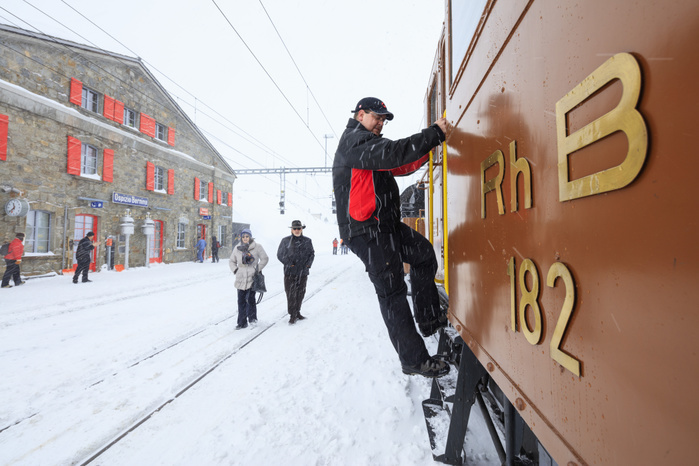 Switzerland Man at work on the snowplow of Bernina Express train, Ospizio Bernina, Poschiavo, canton of Graubunden, Engadin, Switzerland Photo by Roberto Moiola