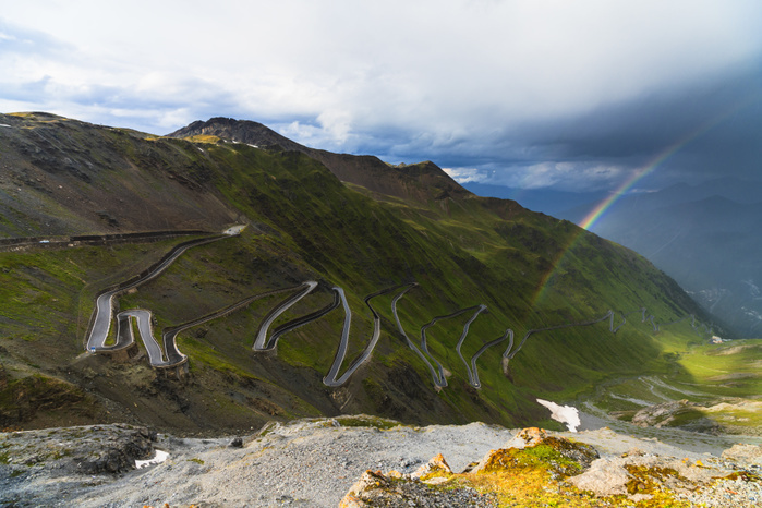 Lombardy, Italy Rainbow on hairpin bends of winding road at Stelvio Pass, South Tyrol side, Valtellina, Lombardy, Italy Photo by Roberto Moiola