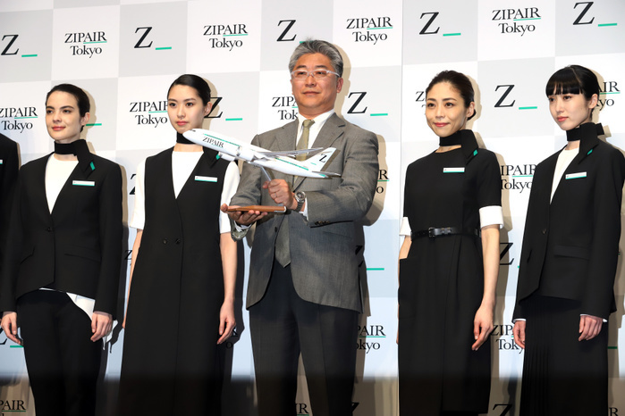 JAL s LCC ZIPAIR displays designs of aircraft and uniforms April 11, 2019, Tokyo, Japan   Shingo Nishida C , president of Japan s low cost carrier ZIPAIR, accompanied by models in unoforms of ZIPAIR displays a model plane of Boeing 787 at a presentation of aircraft design and uniforms of the airline in Tokyo on Thursday, April 11, 2019. Japan Airlines   JAL  wholly owned international budget airline ZIPAIR is expecting to start comercial service in 2020.      Photo by Yoshio Tsunoda AFLO 