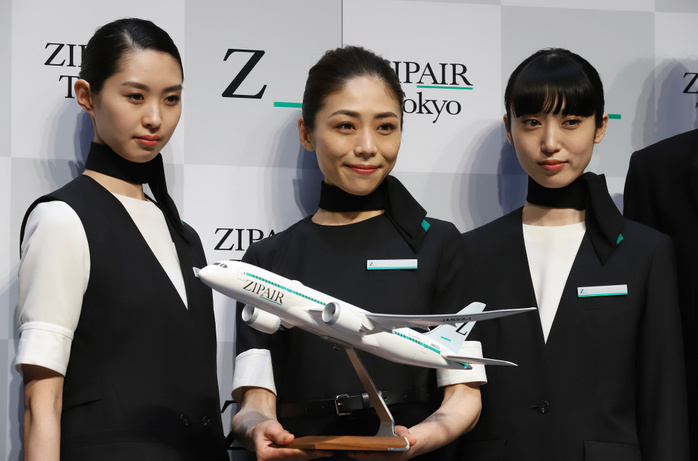 JAL s LCC ZIPAIR displays designs of aircraft and uniforms April 11, 2019, Tokyo, Japan   Models in uniforms of Japan s low cost carrier ZIPAIR display a model plane of Boeing 787 at a presentation of aircraft design and uniforms of the airline in Tokyo on Thursday, April 11, 2019. Japan Airlines   JAL  wholly owned international budget airline ZIPAIR is expecting to start comercial service in 2020.      Photo by Yoshio Tsunoda AFLO 