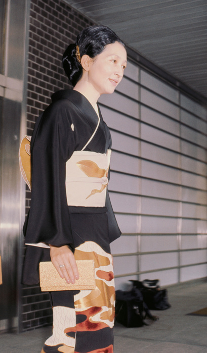 Princess Michiko attends her brother Osamu Shoda's wedding in formal black tomesode. August 1970