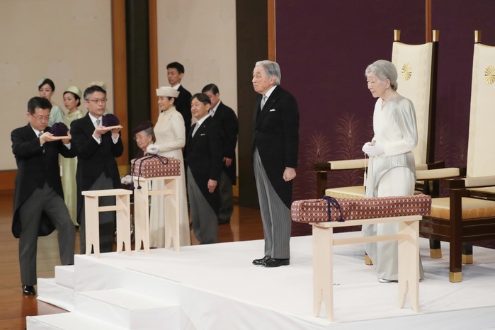 Their Majesties the Emperor and Empress and the Crown Prince and Crown Princess at the  abdication rites  ceremony. In the foreground at left is a chamberlain placing the imperial and national registers on a stand called a  draft. Their Majesties the Emperor and Empress and the Crown Prince and Princess at the  Ceremony of the Abdication Rites  at the Imperial Palace. In the foreground at left is a chamberlain placing the imperial and national registers on a stand called a  draft  in the Pine Room of the Imperial Palace, April 30, 2019, 5:02 p.m. Photo by Representative Photographer