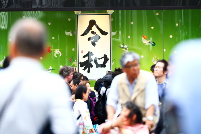 The first day of the Reiwa Era People gather around a calligraphic work showing Japan s new imperial era Reiwa in Tokyo s Ginza shopping district, Japan on May 1, 2019, the first day of the Reiwa Era.  Photo by Naoki Nishimura AFLO 