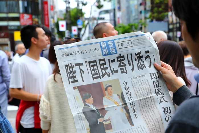 The first day of the Reiwa Era A man reads a copy of extra edition of a newspaper reporting new emperor Naruhito s ascension on the front page in Tokyo s Ginza shopping district, Japan on May 1, 2019, the first day of the Reiwa Era.  Photo by Naoki Nishimura AFLO 