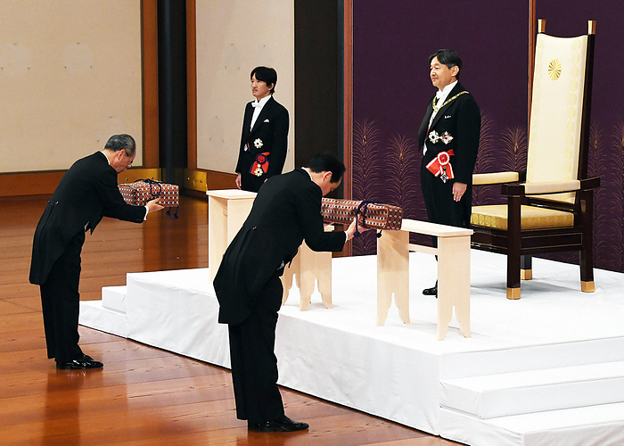 His Majesty the Emperor and His Imperial Highness Prince Akishino at the  Ceremony of the Succession of the Sword and Seal . The new Emperor of Japan, His Imperial Highness Prince Akishino, and His Imperial Highness Prince Hitachi attend the  Succeeding Ceremony of the Sword and the Seal . The attendants hold the Sword  right  and the Seal  Magatama , the  Three Sacred Treasures,  in the Pine Room of the Imperial Palace, May 1, 2019.