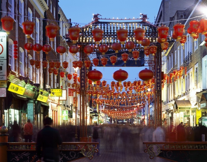 Chinatown, Gerrard Street, London, c1990-2010.  General view of china town at dusk showing the busy street with red lanterns and entrance gateway.