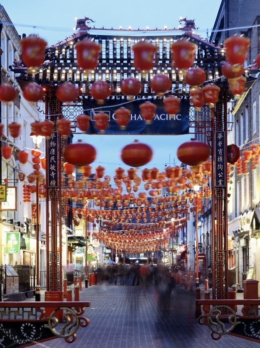 Chinatown, Gerrard Street, London, c1990-2010. General view of china town at dusk showing red lanterns and entrance gateway.