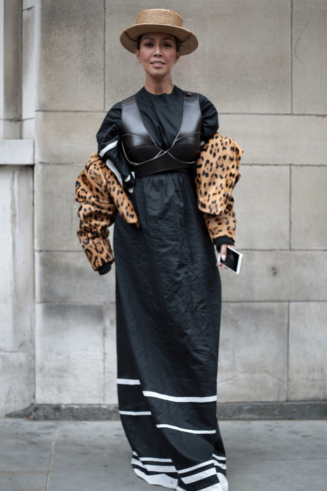 London Fashion Week, Spring Summer 2018 : Street style Street Style from Day one of London Fashion Week, Spring Summer 2018, on Friday September 15th 2017. Ikairia wearing a dress by Vikar Kazinskire, a jacket by Balmain with a vintage straw hat. 