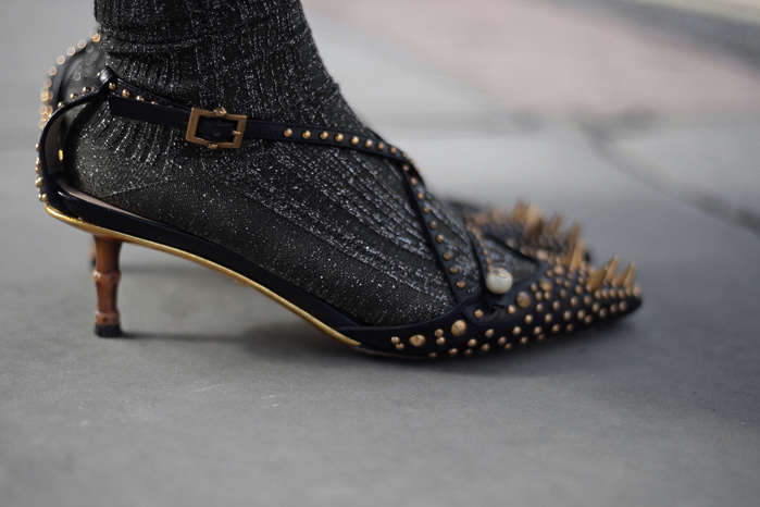 London Fashion Week, Spring Summer 2018 : Street style Street Style from Day two of London Fashion Week, Spring Summer 2018, on Saturday September 16th 2017. Image shows a pair of pretty pair of spiked and studded kitten heels bu Gucci worn with socks.