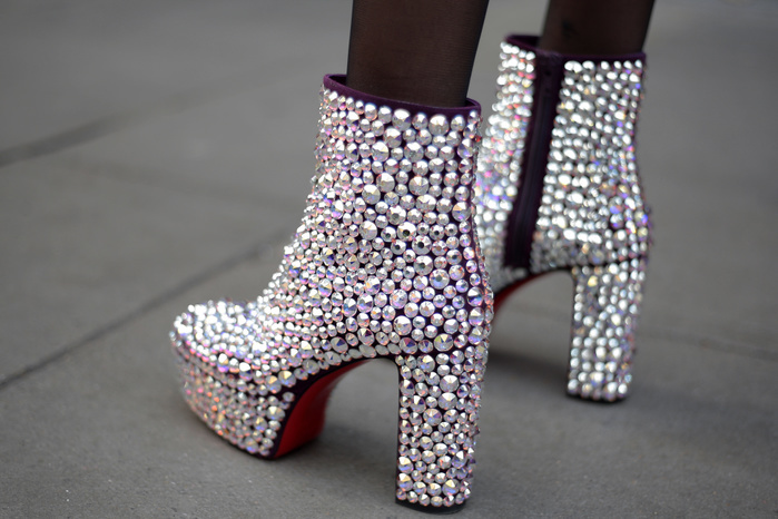 London Fashion Week, Spring Summer 2018 : Street style Street Style from Day three of London Fashion Week, Spring Summer 2018, on Sunday September 17th 2017. Image shows a pair of studded rhinestone ankle boots by Christian Louboutin. 