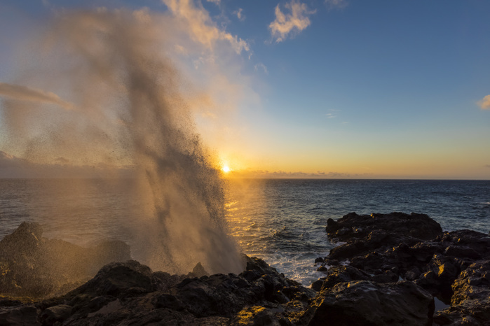 France Reunion, West Coast, rocky coast at Souffleur, water fountain at sunset
