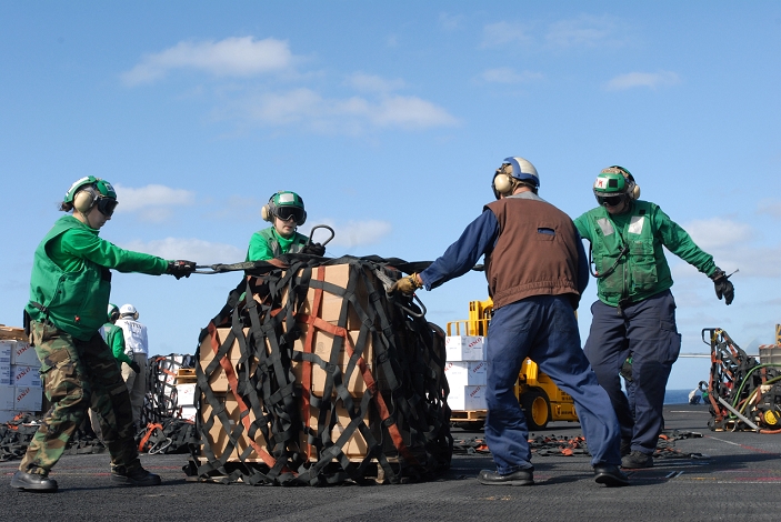 Luxury cruise ship catches fire off the coast of California U.S. aircraft carrier carries emergency supplies PACIFIC OCEAN  Nov. 9, 2010  Sailors assigned to the supply department of the aircraft carrier USS Ronald Reagan  CVN 76  secure a cargo net around a pallet of supplies in preparation for an emergency vertical replenishment to supply a stranded cruise ship. Ronald Reagan was diverted from its current training maneuvers at the direction of Commander U.S. Third Fleet, and at the request of the U.S. Coast Guard, to a position south near the Carnival cruise ship C V Splendor to facilitate the delivery of 4,500 pounds of supplies to the cruise ship. Early Monday, CV Splendor reported it was dead in the water 150 nautical miles southwest of San Diego.   Photo by U.S. Navy AFLO   0006 