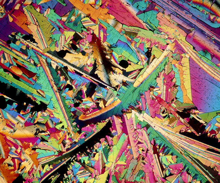 Polarised light micrograph of crystals of sulphur. Sulphur is a yellow non-metallic element in group IV of the Periodic Table. It is often found associated with oil deposits and with volcanic exhalations. Its main uses are in the manufacture of sulphuric acid, the vulcanisation of rubber, and the manufacture of explosives, fungicides and fertilizers.