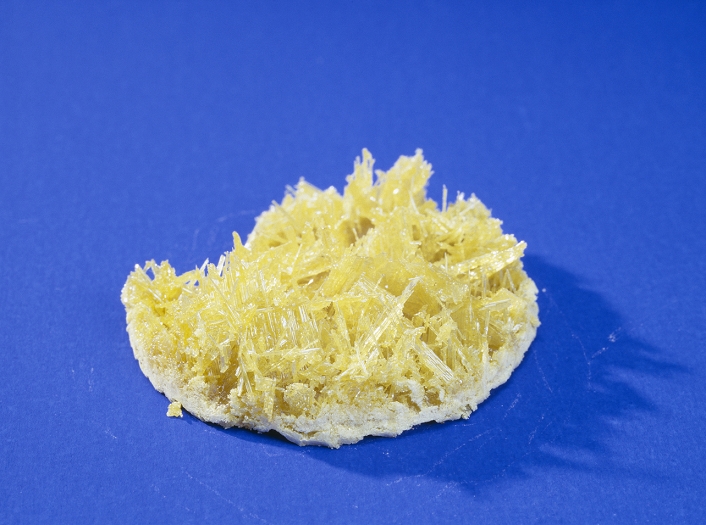 Sulphur crystals. Sulphur (chemical symbol S) is a nonmetallic yellow solid at room temperature. This monoclinic crystalline shape is produced when sulphur crystallises slowly out of solution. Sulphur is used in the manufacture of sulphuric acid, black gunpowder, the vulcanization of rubber and as a fungicide.