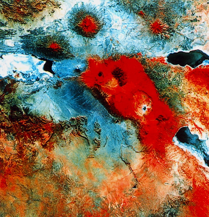 Landsat photograph of part of northern Tanzania, including the volcanic Ngorongoro crater, the volcano Ol Doinyo Lengai, part of the Serengeti Plain, the Olduvai Gorge and part of Lake Natron. Infrared image.