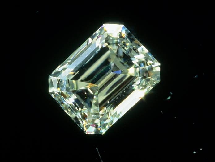 An octagonal cut diamond. Diamond is a naturally occurring form of carbon which has crystallised under great pressure. The crystals may be colourless and transparent or yellow, brown or black. Attractive varieties are highly prized as gemstones. Diamond is the hardest known mineral and the poorer quality specimens are used extensively in industry, mainly for cutting and grinding tools. Industrial-quality diamonds can be produced synthetically.