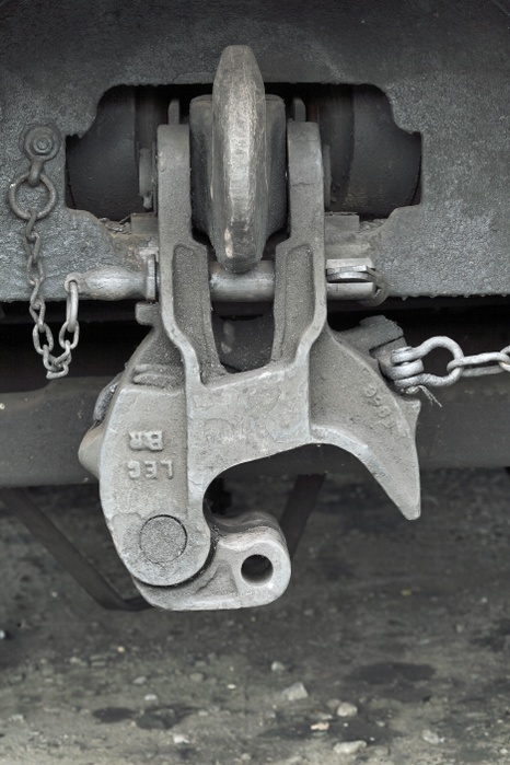 Buckeye coupling on train carriage Buckeye coupling on train carriage. This automatic coupler, when in its horizontal position, couples railway rolling stock together to form a train. It consists of a massive steel block with a hinged jaw or  knuckle  at the end. Here, the device is hanging downwards on an uncoupled railway carriage. The Buckeye coupling was invented in the USA in 1879 by Eli Janney. The name comes from the nickname of Ohio, the  Buckeye  state, where the original manufacturer of the coupling, the Ohio Brass Company, was based. A Buckeye coupling weighs almost 90 kilograms. Photographed in the UK.