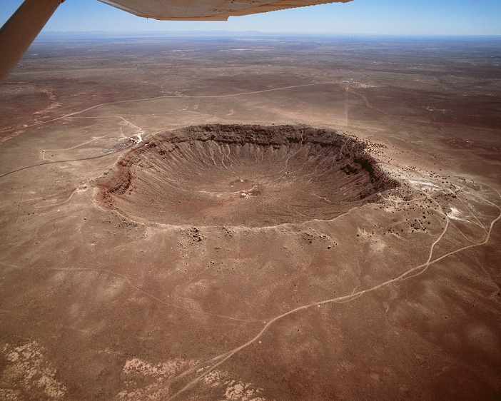 Ballinger Crater, Arizona, U.S.A.  Date of photograph unknown  Aerial view of Meteor Crater, Arizona. Sometimes called the Barringer Crater, it was recognised as a meteor impact crater early in the 20th century and is thought to be about 25,000 years old. Several attempts to mine the iron rich material of the meteor were made before a visitor centre was built in the 1960 s. The crater is in northeastern Arizona, near Winslow, and is about 200 metres  600 feet  deep and 800 metres  1 2 mile  across.