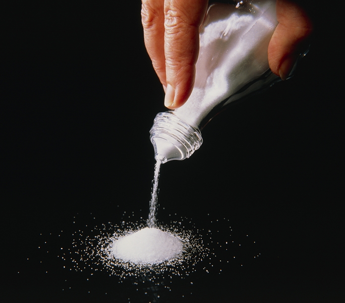 Salt (sodium chloride) being poured from a salt- cellar. Sodium is an essential mineral in the body. It occurs in body fluids such as blood, sweat & tears. Its presence in the nervous system enables the transmission of electrical signals along the axon. The required dietary intake is debatable as are the consequences to the human body of over and under consumption. A reduction in salt intake may help to reduce high blood pressure in some people.
