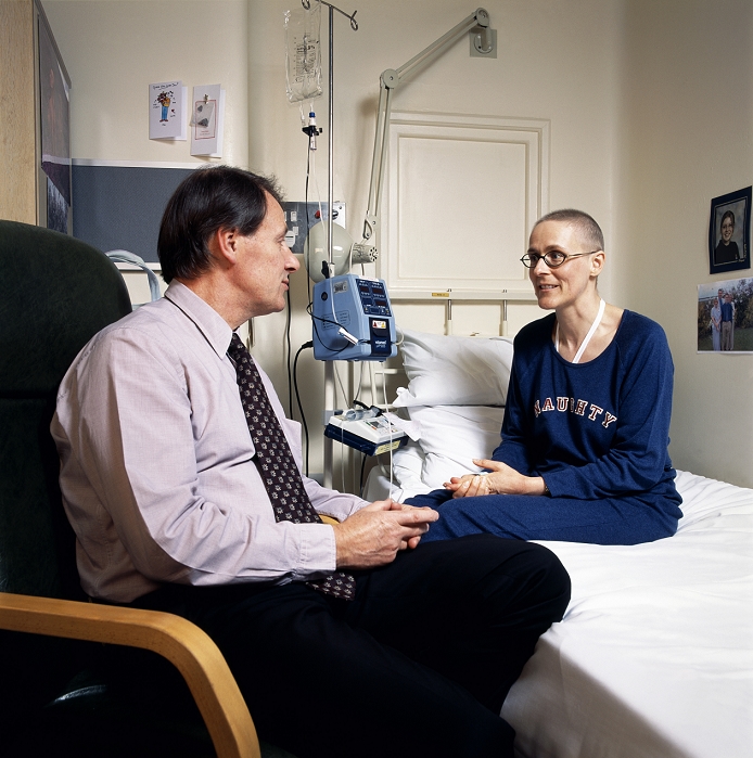 . Leukaemia patient talking with consultant Professor Stephen Proctor. The patient is suffering from acute promyelocytic leukaemia (APL), which results in the presence of many promyelocyte cells. These cells have a granular cytoplasm and are precursors for other cells. APL results in malaise, shortness of breath and spontaneous bruising. Current treatment involves transfusions of plasma and platelets as well chemotherapy. Although the treatment is also a major cause of mortality due to intracranial bleeding. Professor Proctor is investigating the use of stem cells to treat this leukaemia, which would not carry the risk of death. MODEL RELEASED