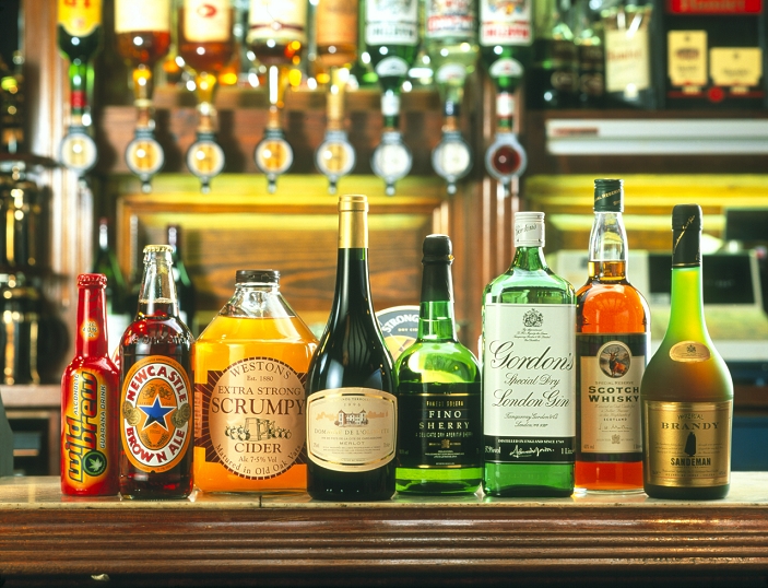Alcoholic drinks ranging from low to high alcohol content. From the left the amount of alcohol as a percentage of the contents is given in brackets: alcopop (4), beer (4.7), cider (7.5), wine (12), sherry (16.5), gin (37.5), whisky (40) and brandy (40). Alcohol is an addictive drug that can cause long-term liver and brain damage.