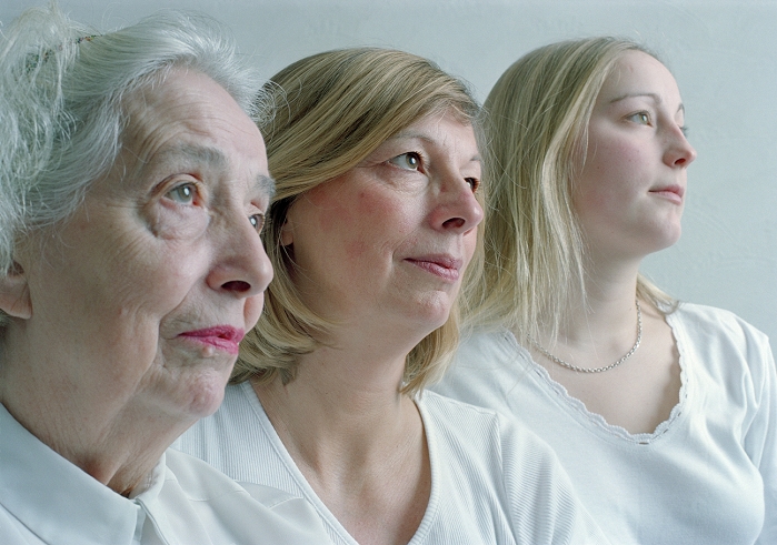 . Family. Profile of three female generations of a family. From left to right are grandmother, daughter and granddaughter. MODEL RELEASED