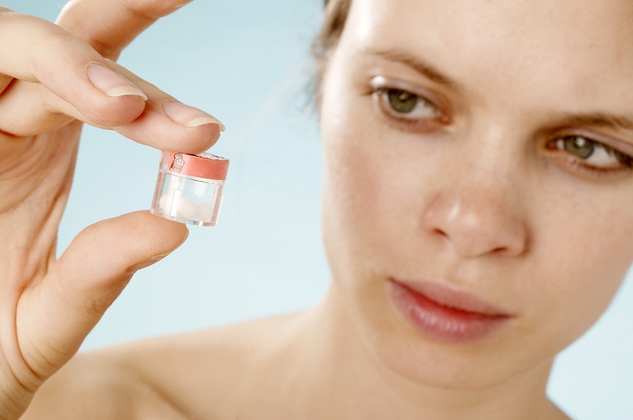 . Homeopathy pills being held by a woman. Homeopathy is an alternative medicine that aims to treat diseases by giving extremely dilute doses of compounds that cause the same symptoms as the disease. The more dilute the dosage, the more powerful the remedy. Some of the most powerful doses are so dilute that it is likely they do not contain a single molecule of the active substance. Practitioners attribute this to the 'memory' of the water in which they are diluted. Conventional science has subjected these claims to intense scrutiny, but firm evidence of anything other than the placebo effect has not yet been found. MODEL RELEASED