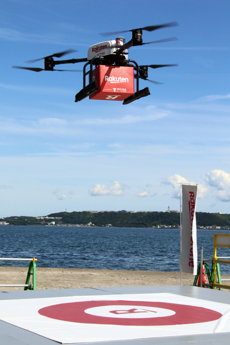 Rakuten and Seiyu have a demonstration of drone delivery service as they will start the service June 17, 2019, Yokosuka, Japan   A drone arrives at Sarushima island off the coast of Yokosuka in Tokyo Bay for a demonstration of a drone delivery service from Yokosuka, some 2km far from Yokosuka on Monday, June 17, 2019. Japanese e commerce giant Rakuten and Walmart s subsidiary Seiyu supermarket chain will launch a drone delive service between Sarushima island and Seiyu s shopping mall in Yokosuka city from July 4 as the remote islnad has no supermarket and convenience store.    Photo by Yoshio Tsunoda AFLO 