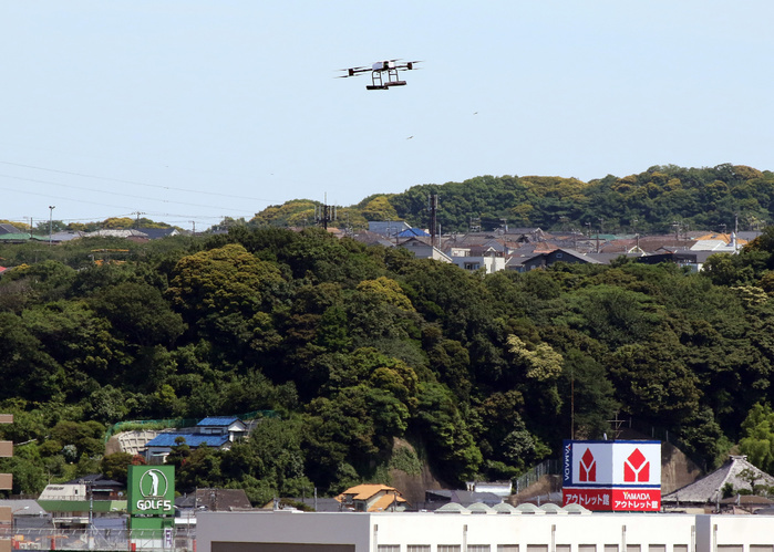 Rakuten and Seiyu have a demonstration of drone delivery service as they will start the service June 17, 2019, Yokosuka, Japan   A drone returns from Sarushima island off the coast of Yokosuka in Tokyo Bay for a demonstration of a drone delivery service from Yokosuka, some 2km far from Yokosuka on Monday, June 17, 2019. Japanese e commerce giant Rakuten and Walmart s subsidiary Seiyu supermarket chain will launch a drone delive service between Sarushima island and Seiyu s shopping mall in Yokosuka city from July 4 as the remote islnad has no supermarket and convenience store.    Photo by Yoshio Tsunoda AFLO 
