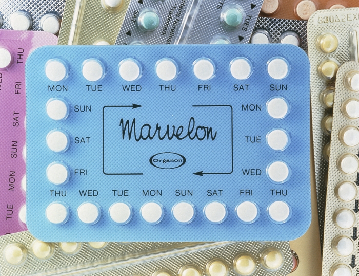 Contraceptive pills. Assorted oral contraceptive pills used for birth control. Dates are present on the packs of 20 to ensure that the correct dose is taken & to prevent omission of the daily dose. The contraceptive pill contains one or more synthetic female sex hormones. Most contraceptive pills consist of both a progesterone & an oestrogen. Progesterone acts on the pituitary gland affecting the menstrual cycle, & oestrogen blocks the monthly release of a mature egg (ovulation). The unwanted pregnancy rate is less than 1 per 100 woman years. Side effects from using the pill include headache, weight gain, nausea & higher risks of cervical cancer & thrombosis.