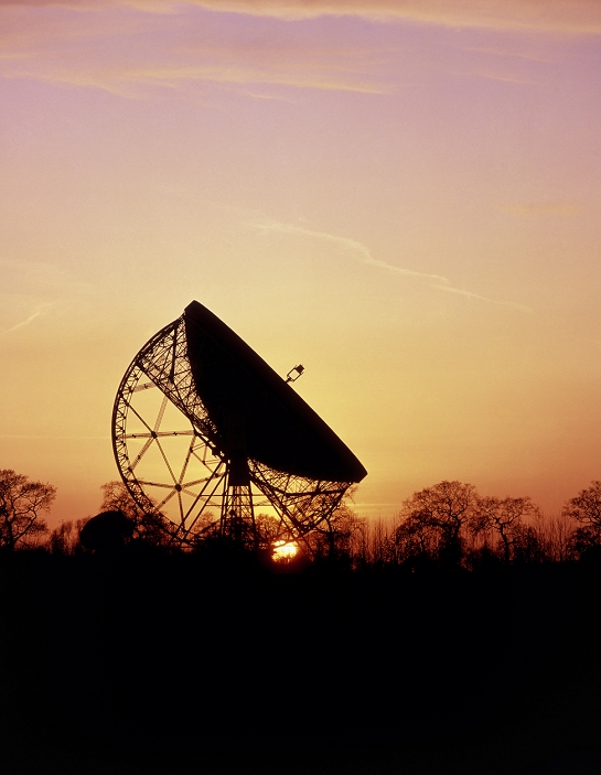 United Kingdom  Label Radio Telescope  Date and time unknown  Lovell Radio Telescope at Jodrell Bank. The dish of the Lovell Radio Telescope dominates the horizon at the Jodrell Bank Observatory at sunset. The telescope dish has a diameter of 76 metres, and was the first large dish radio telescope in the world. It is named in honour of Sir Bernard Lovell, British astronomer. The Jodrell Bank Observatory is near Macclesfield in Cheshire, UK.