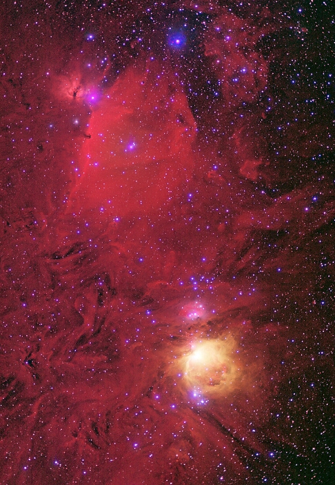 Nebulae in Orion. Enhanced optical image of nebulae in the constellation Orion. At lower centre is the Orion nebula (yellow, M42 & M43), a starbirth region 1500 light years from Earth. At upper left, a dark cloud is seen obscuring some of the red nebula to its right. The bright star at the tip of the dark intrusion is Zeta Orionis, or Alnitak. Below this star is the Horsehead nebula, a small dark cloud silhouetted against the red nebula. The bright star at top centre is Epsilon Orionis, or Alnilam. This image was produced by a CCD (charge-coupled device) camera, which stores images electronically rather than on film.
