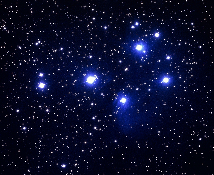 ^BTHIS PICTURE MAY NOT BE USED TO STATE OR IMPLY THE ^BENDORSEMENT BY NOAO OF ANY COMPANY OR PRODUCT. *** THIS PICTURE MAY NOT BE USED TO STATE OR IMPLY  NOAO ENDORSEMENT OF ANY COMPANY OR PRODUCT *** Optical photo of the Pleiades (M45 & NGC 1432), a cluster of stars some 400 light years away in the constellation of Taurus. The brightest stars are embedded within streaky reflection nebulae (wisps of cold gas & dust which reflect the light of the young stars). The cluster is also known as the Seven Sisters, although most people can see only the six brightest stars with the naked eye. There has been speculation that the seventh 'lost' Pleiad has faded since ancient times. The cluster in fact has 300 to 500 members, most of which are contained within a sphere 30 light years across.