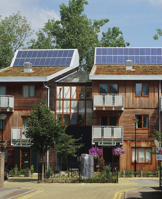 Photovoltaic cells on houses. These buildings are part of the Greenfields Development in Maidenhead, UK. The solar modules are located on the roofs of the buildings, facing south west for optimal solar gain.