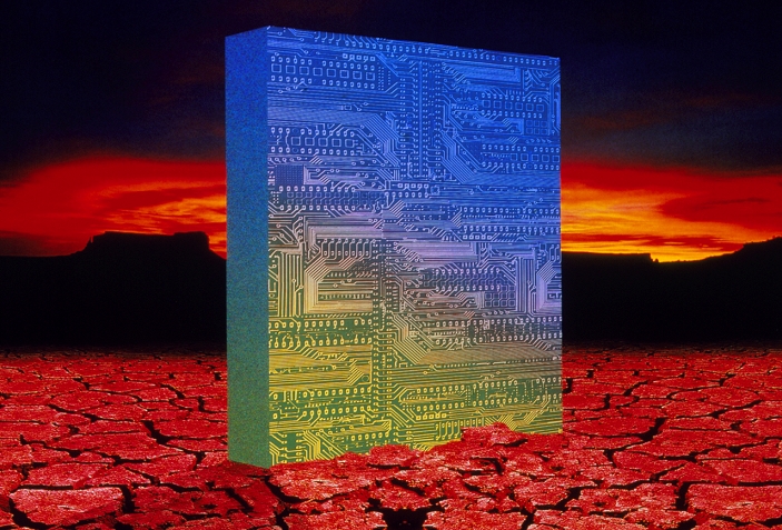 Circuit board monolith. Abstract illustration representing the Age of technology. A huge computer circuit board rises from the cracked desert floor.