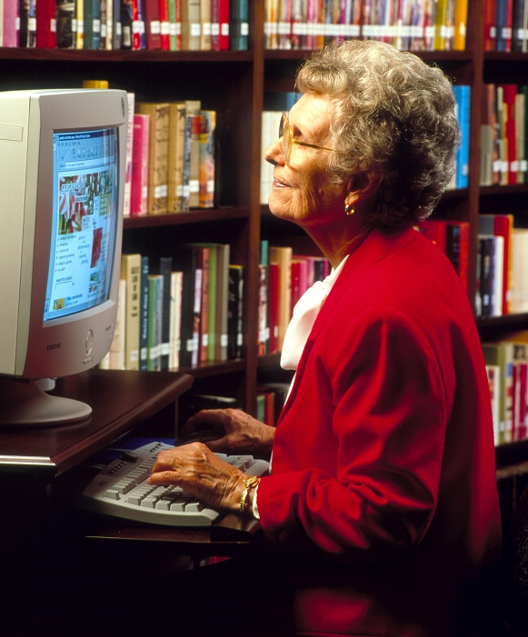 . World Wide Web use. Elderly woman at a computer screen accesses a page from the World Wide Web (WWW or Web) on the internet. The Web is a global network connecting thousands of host computers for the free exchange of information. Information on the page is stored in the form of hypertext documents - text documents which have other data (such as pictures or links to other host sites) embedded in them. Web data are read using a browser program to automatically connect the user to other host computers. Browsers make the web easy to use even for someone with no computer knowledge. MODEL RELEASED