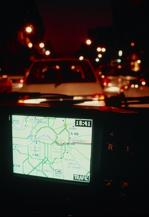 CARMINAT car navigation system. A passenger's view of a map warning of a traffic jam (red line) in Paris, as displayed by the CARMINAT in-car computer. CARMINAT may be used as a database to plan routes or to locate buildings such as petrol stations, hotels, restaurants or hospitals. With an FM radio link to the SIRIUS traffic monitoring system, CARMINAT may also provide warnings of traffic jams, accidents or diversions on the road ahead as soon as a problem arises. The system can also be used to provide details of local weather, train and airline timetables and the availability of car parking at major venues.