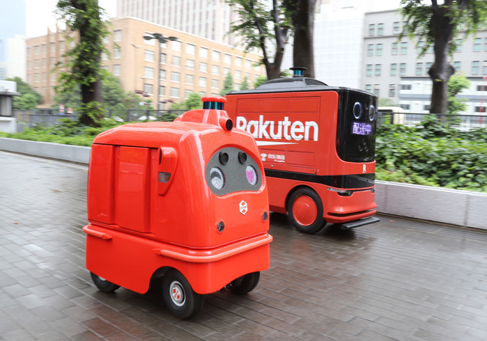 Delivery robots are displayed as public private council is set up to promote last one mile delivery robots June 24, 2019, Tokyo, Japan   Delivery robots, ZMP s CaliRo Deli of Japan  L  and Chinese e commerce company DJ.com s delivery robot run for a demonstration at the entrance of the Ministry of Economy, Trade and Industry  METI  in Tokyo on Monday, June 24, 2019. METI and private companies set up a public private council to promote autonomous delivery robots for the last one mile delivery of parcels.    Photo by Yoshio Tsunoda AFLO 