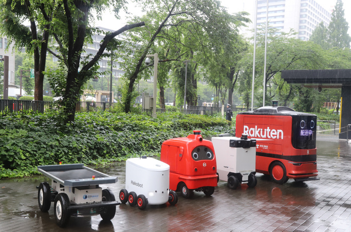 Delivery robots are displayed as public private council is set up to promote last one mile delivery robots June 24, 2019, Tokyo, Japan   Delivery robots  L R  Effidence s EffiBOT of France, Japan s Hakobot, ZMP s CaliRo Deli of Japan, Marble of the United States and Chinese e commerce company DJ.com s delivery robot are displayed at the entrance of the Ministry of Economy, Trade and Industry  METI  in Tokyo on Monday, June 24, 2019. METI and private companies set up a public private council to promote autonomous delivery robots for the last one mile delivery of parcels.    Photo by Yoshio Tsunoda AFLO 