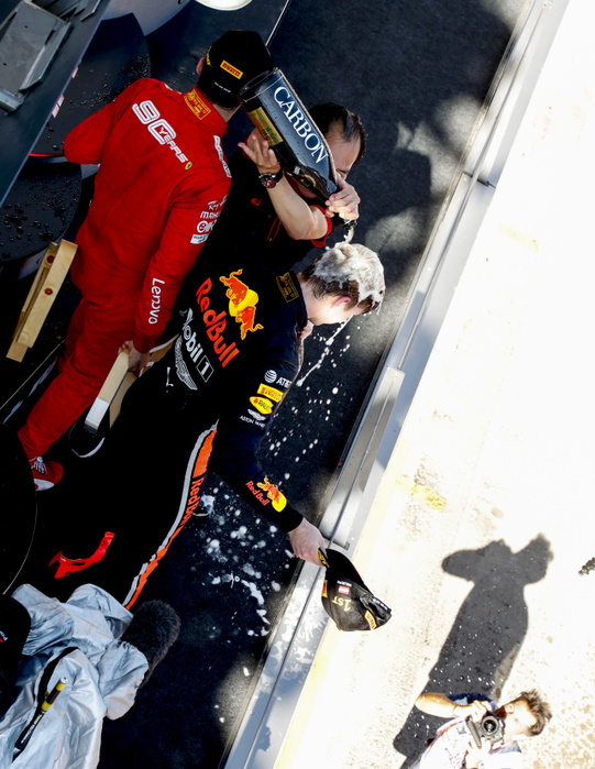 Motorsports: FIA Formula One World Championship 2019, Grand Prix of Austria Red Bull Racing s Dutch driver Max Verstappen, bottom, is soaked  in champagne by Honda Racing F1 Technical Director Toyoharu Tanabe, top, as he celebrates on the podium after  the Austrian Formula One Grand Prix at Red Bull Ring in Spielberg, Austria on June 30, 2019.  Photo by AFLO 