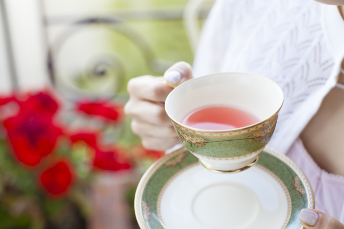 Woman drinking rose hip tea