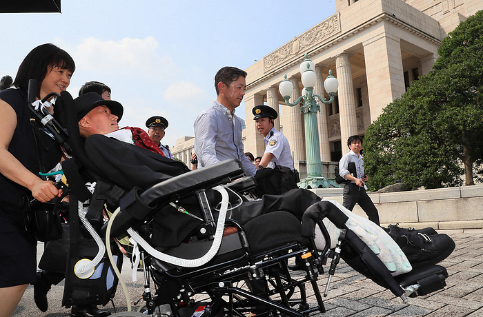 Parliament Mr. Funago of the  Reiwa Newly Elected  group, who is in a wheelchair for the first time in the Diet Yasuhiko Funago, a member of the Reiwa Shinsengumi, makes his first appearance in the House of Representatives in his wheelchair at 9:36 a.m. on August 1, 2019, in the National Diet building in Chiyoda Ward, Tokyo, Japan  photo by Tatsuro Tamashiro.