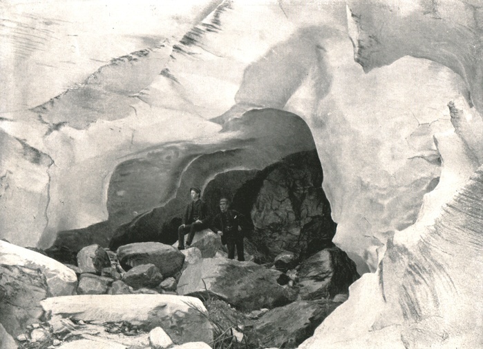 The Rockies: ice cave in the Great Glacier, Mount Sir Donald, Canada, 1895.  Creator: William Notman  amp  Son. The Rockies: ice cave in the Great Glacier, Mount Sir Donald, Canada, 1895. People standing at the entrance to a cave in the ice of a glacier on Mount Sir Donald in the Rogers Pass area of British Columbia. From Round the World in Pictures and Photographs: From London Bridge to Charing Cross via Yokohama and Chicago.  George Newnes Ltd, London, 1895 