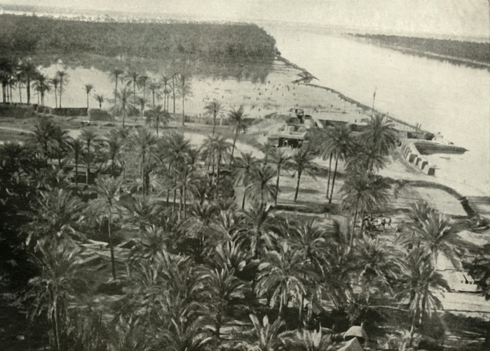  A British Position on the River Tigris ,  1919 . Creator: Unknown.  A British Position on the River Tigris ,  1919 . Scene from the First World War, 1914 1919:  Photograph by a British airman, showing one of the important points in the line of advance on Baghdad  in modern day Iraq  up the valley of the Tigris. Along the banks...are numerous patches of cultivated gardens and villages within high mud wall enclosures, belts of date palms, with an occasional fringe of willow, which in the rainy season become mere oases in a vast inland sea.  From The History of the Great European War: its causes and effects, Vol. V, by W. Stanley Macbean Knight.  Caxton Pulishing Company, Limited, London, 1919 