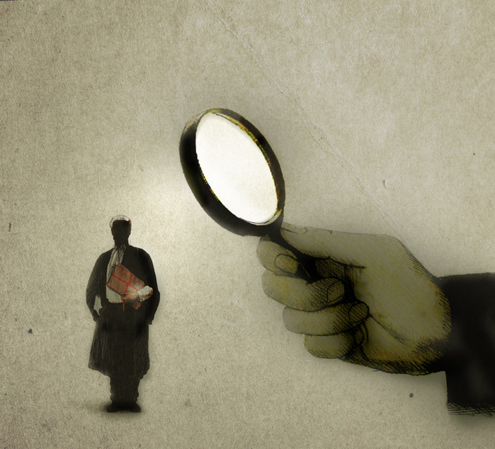 a concept image of a hand holding a magnifying glass over a barrister depicting an examination of the legal profession