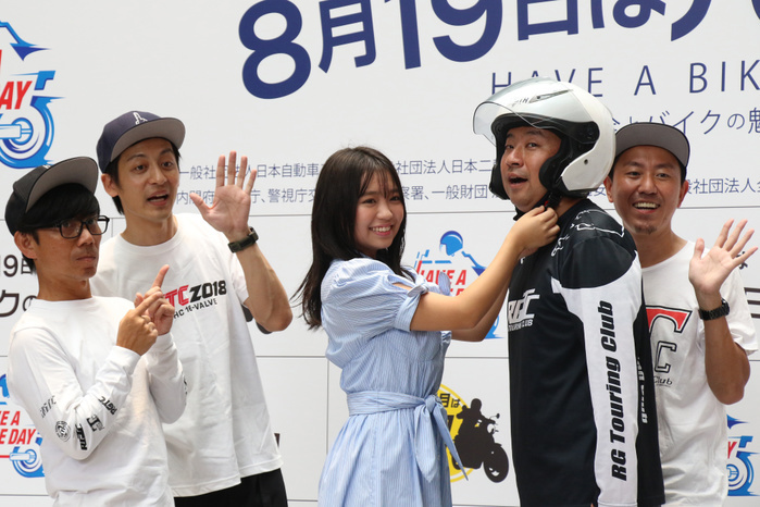 Motorcycle promotional event  Have a Bike Day  is held with comedians August 19, 2019, Tokyo, Japan   Japanese model Yuno Ohara  C  fasytens the chin strap of a helmet of RG  2nd R  of comedy duo Razor Ramon while Mitsunori Fukuda of Tutorial  L , Motohiro Takewaka of Buffalo Goro  L  and Hideaki Murata of ToroSalmon  2nd R  look on at a promotional event of motorcycle,  Have a Bike Day   the day of 819 or Baiku no hi  in Tokyo on Monday, August 19, 2019. The event was held for the campaign against traffic accidents of motorcycles.     Photo by Yoshio Tsunoda AFLO 